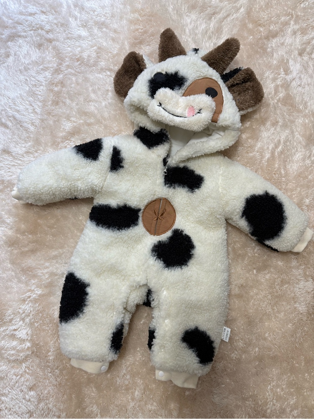 Cozy Cow Print Sherpa Baby One-Piece - Ivory & Black